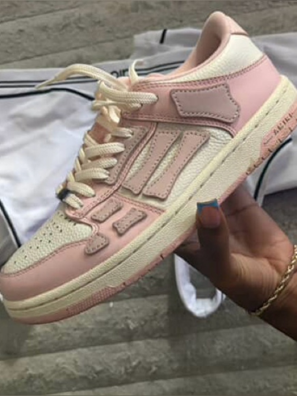 Women’s Low-Top AMIRI Sneaker in Light Pink and Cream